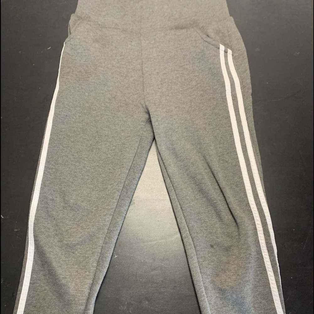 Grey sweatpants with white stripes